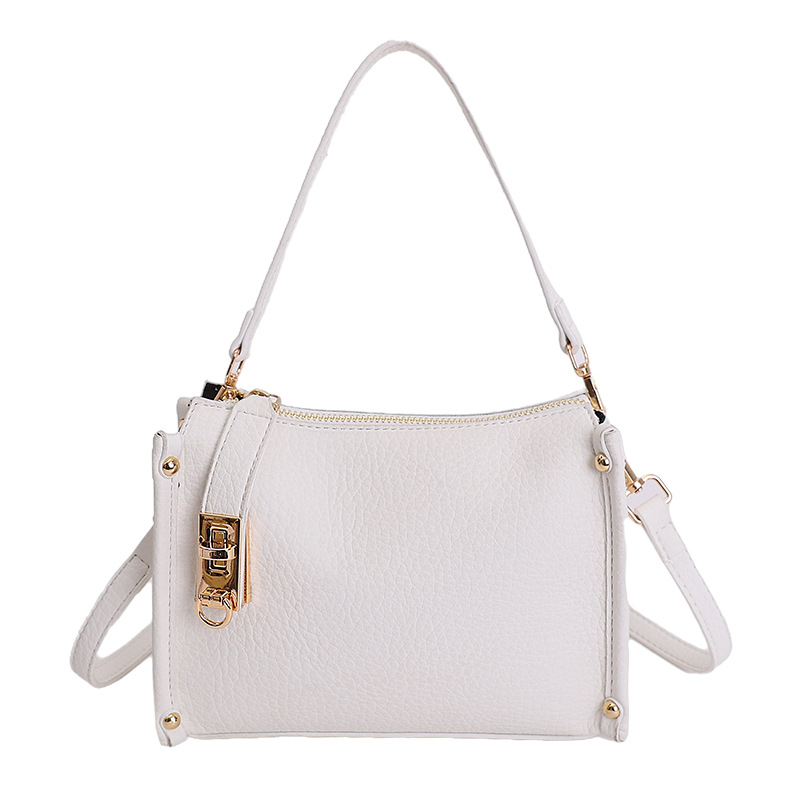 Nicho Zhong textura bolso de mujer 2026 nuevo remaches de gran capacidad simple de hombro simple bolso de brazo de viaje