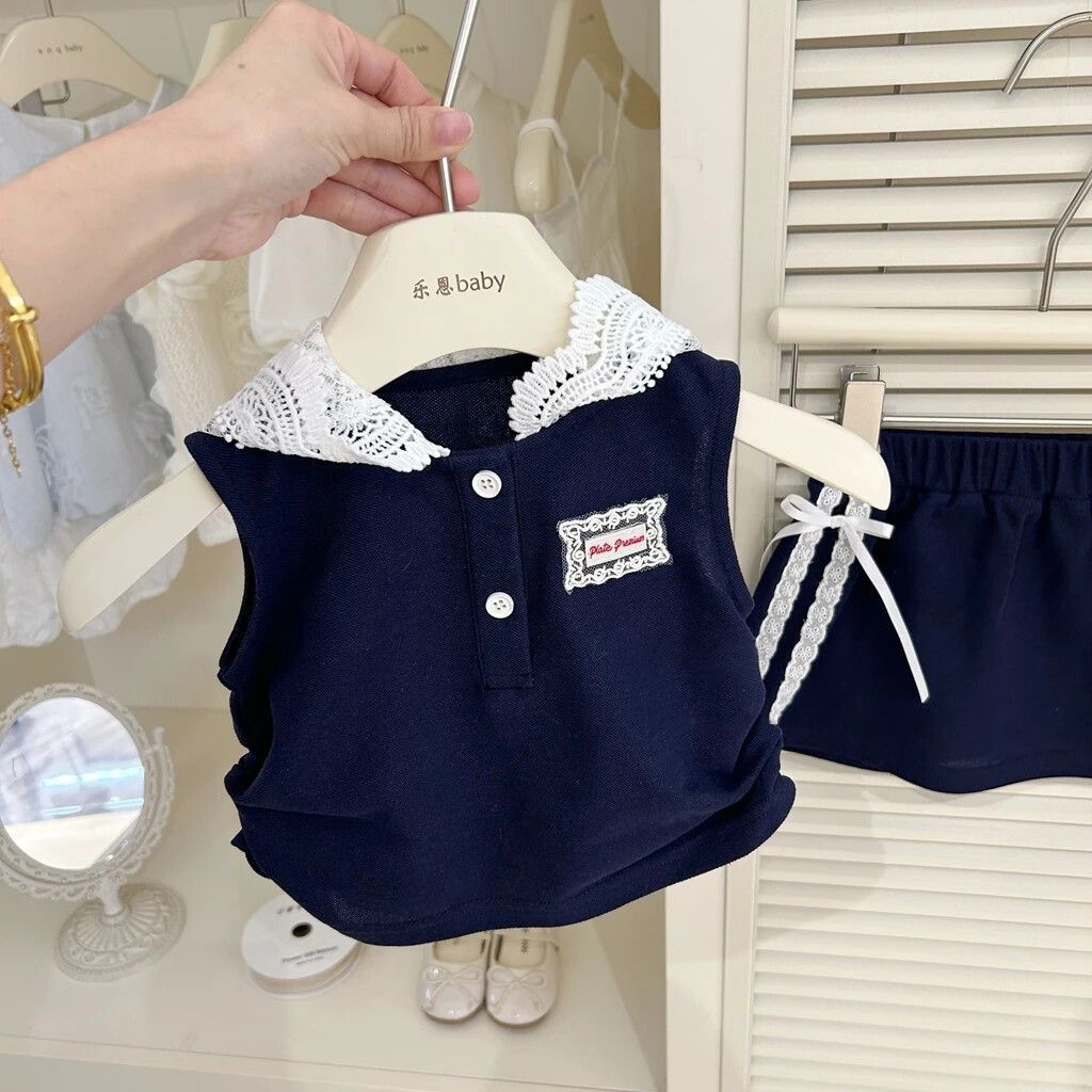 Bebé niñas nuevo conjunto de estilo extranjero de verano 2025 nuevo chaleco sin mangas de moda de la escuela dos piezas de falda