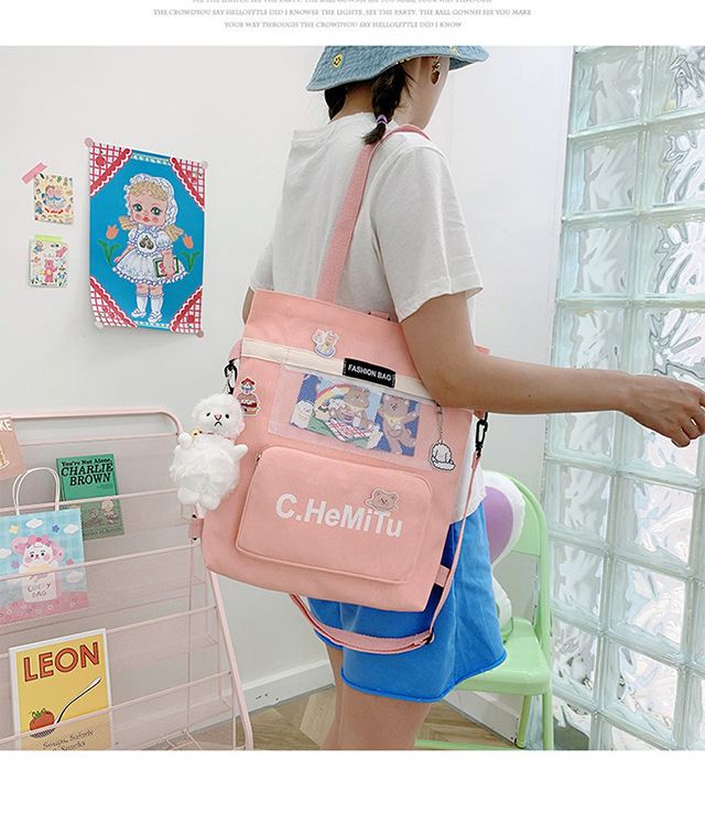 Korean-style canvas bag for girls with one shoulder, in the style of Harajuku, ulzzang, with a large capacity and contrasting colors, is a crossbody hand-held schoolbag for classes undefined