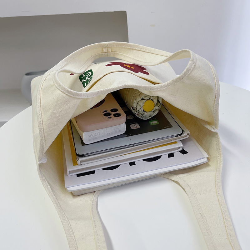 Bolsa de lona del estudiante 2024 nueva moda crossbody bolso de hombro japonés femenino estilo coreano versátil estudiante clase Portátil Bolsa de libros