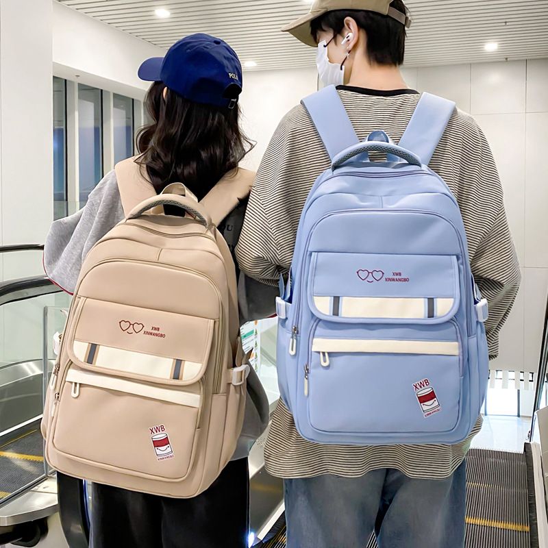 Al por mayor nueva mochila coreana universitaria simple mochila de alto valor de la cara, mochila de niñas de gran capacidad para estudiantes de secundaria