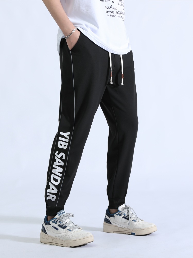 Pantalones deportivos para hombres primavera y otoño tendencia juvenil guapo ocio versátil cintura elástica transpirable pie pantalones largos