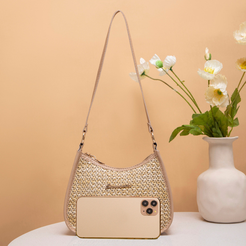 Fresco dulce 2025 nuevo bolso de paja de mujer, bolso de hombro de moda versátil, bolso de brazo de mujer nicho