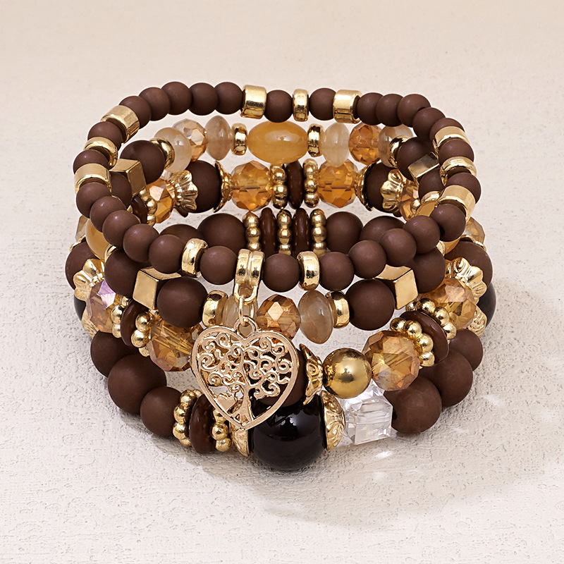 Four-piece set of beaded Bohemian ethnic style multi-layer glass bead bracelets with heart pendants for women, personalized hand accessories wholesale
