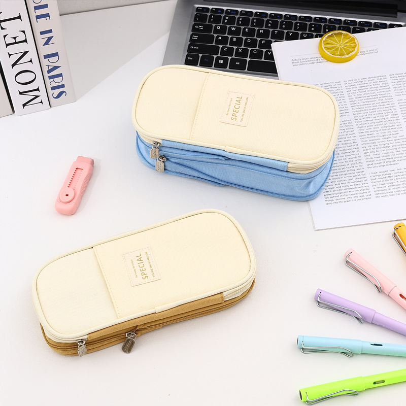 Bolso de lápices retráctil de lona de color de contraste de estilo explosivo transfronterizo Bolso de papelería de gran capacidad con doble cremallera simple multifuncional para estudiantes