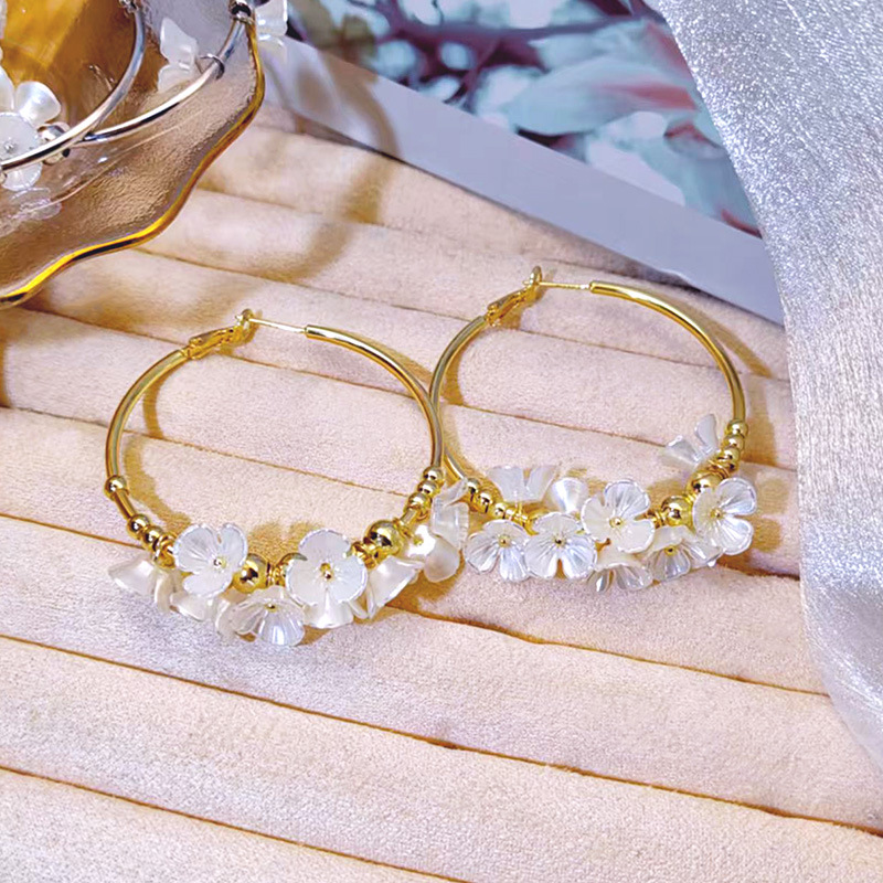 Fashionable cute white earrings with tassels