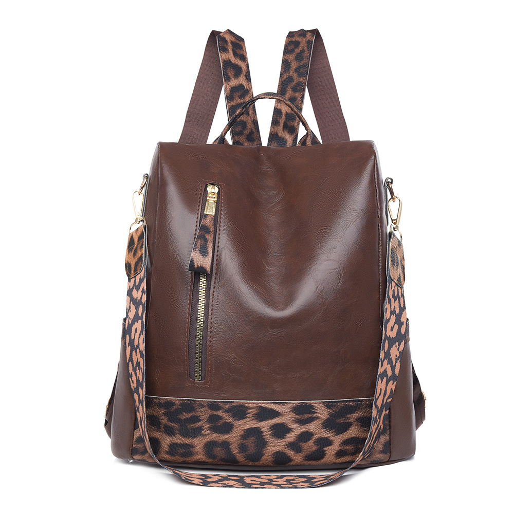 Fabricantes al por mayor 2025 nueva mochila de cuero suave para damas retro europeas y americanas moda estampado de leopardo contraste color bolso de mochila antirrobo