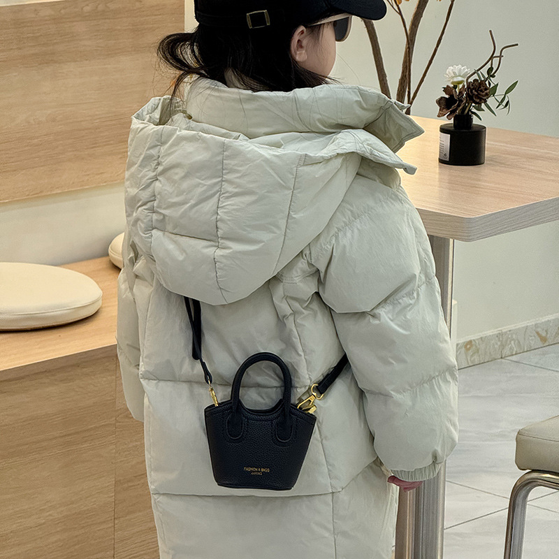 Bagos de cestas de verduras para niños 2025 nuevo estilo coreano simple color sólido bolso de mochila para niños estilo extranjero mini bolso de niña