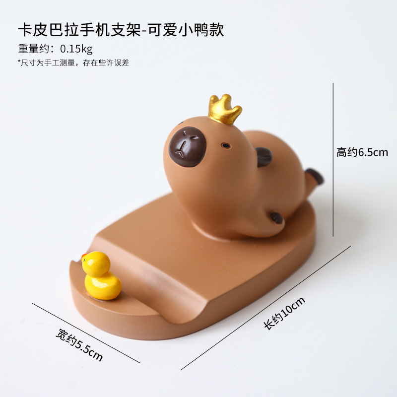 Dibujos animados linda celebridad de Internet Kapibala soporte para teléfono móvil decoración escritorio de oficina estación perezosa soporte plano artefacto