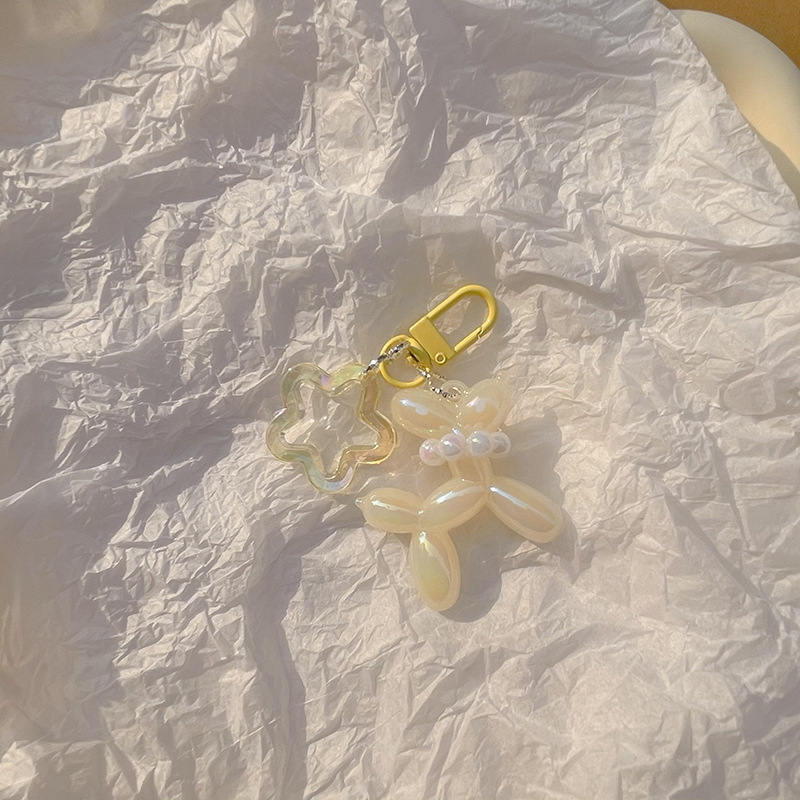 Pequeño Libro Rojo mismo lindo jalea globo láser perro llavero colgante colorido cachorro de dibujos animados teléfono llavero