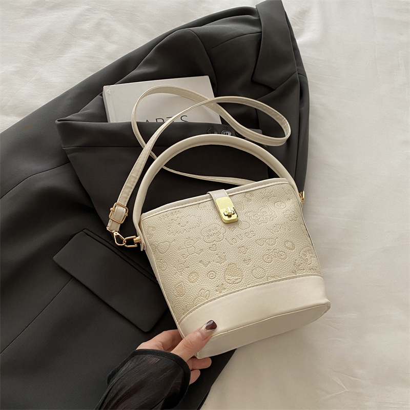 Otoño e invierno nuevo bolso de mujer 2024 moda caricatura bolso de cubo de mano versátil estilo extranjero mochila de viaje