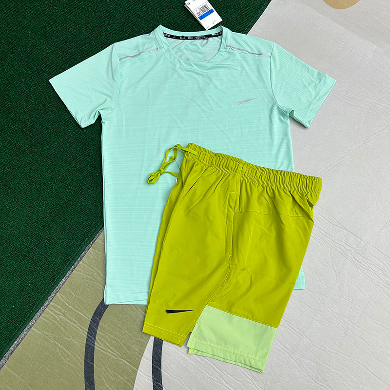 Mayorista nuevo juego de comercio exterior deportivo fitness juego de carrera rápida secado transpirable suelto ocio pantalones cortos de manga corta ropa de hombre