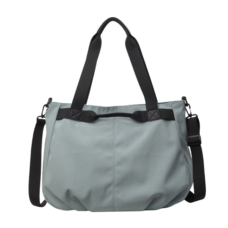 Bolsos de viaje transfronterizos de gran capacidad Bolsos de tela Oxford simples de moda femenina Bolsos tote de todo fósforo Bolsos de hombro de moda coreana