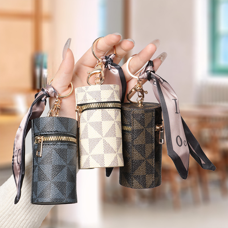 European and American presbyter coin purse 2024 new compact bag pendant earphone bag mouth red envelope mini keychain bag