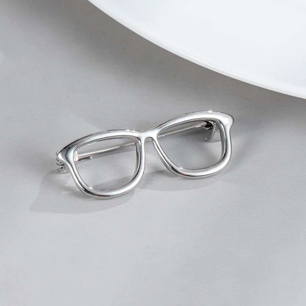 Glasses, silver brooch