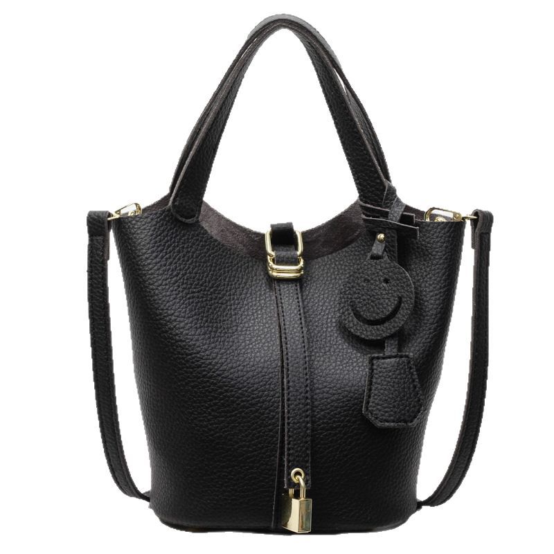 Bolso de cubo portátil con patrón de lichi de alta gama para mujer 2025 nuevo bolso de hombro de todo fósforo de moda bolso de mensajero casual de estilo occidental