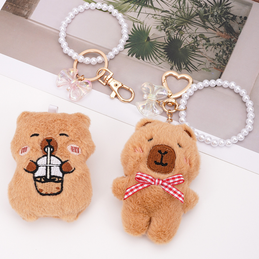 Colgante de bolso de animal de dibujos animados lindo Kapibala niña mochila llavero accesorios colgantes de perlas de felpa
