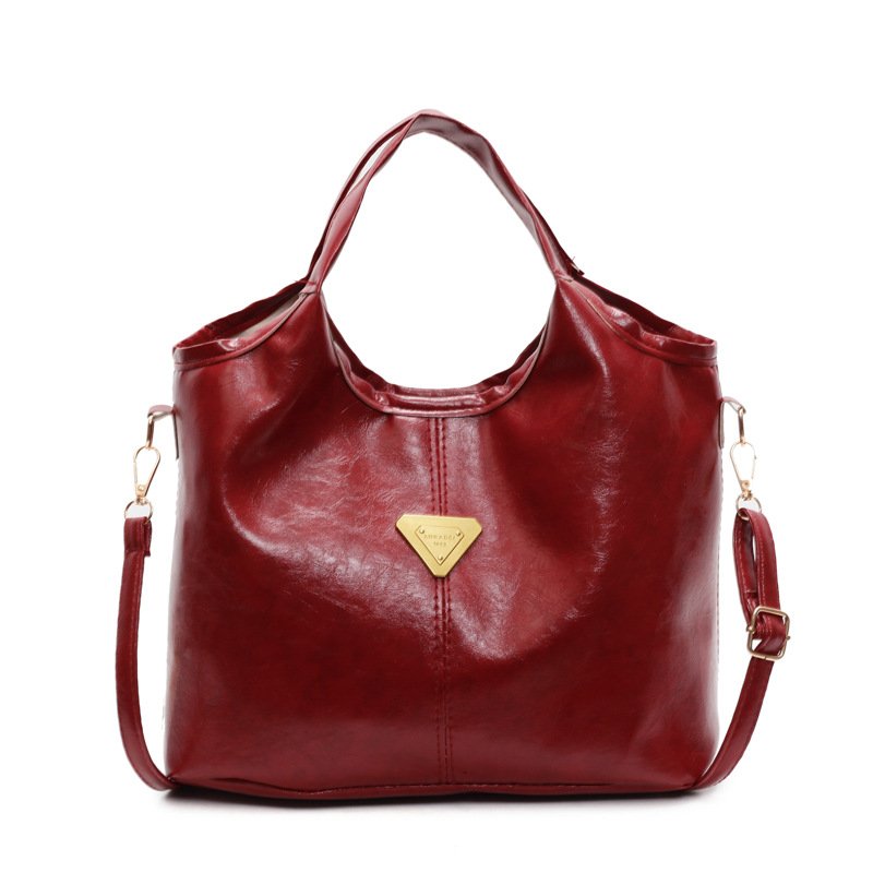 Tide retro nicho bolso de mano mujer 2025 primavera nueva piel de cera de aceite de transporte de gran capacidad bolso de hombro mochila