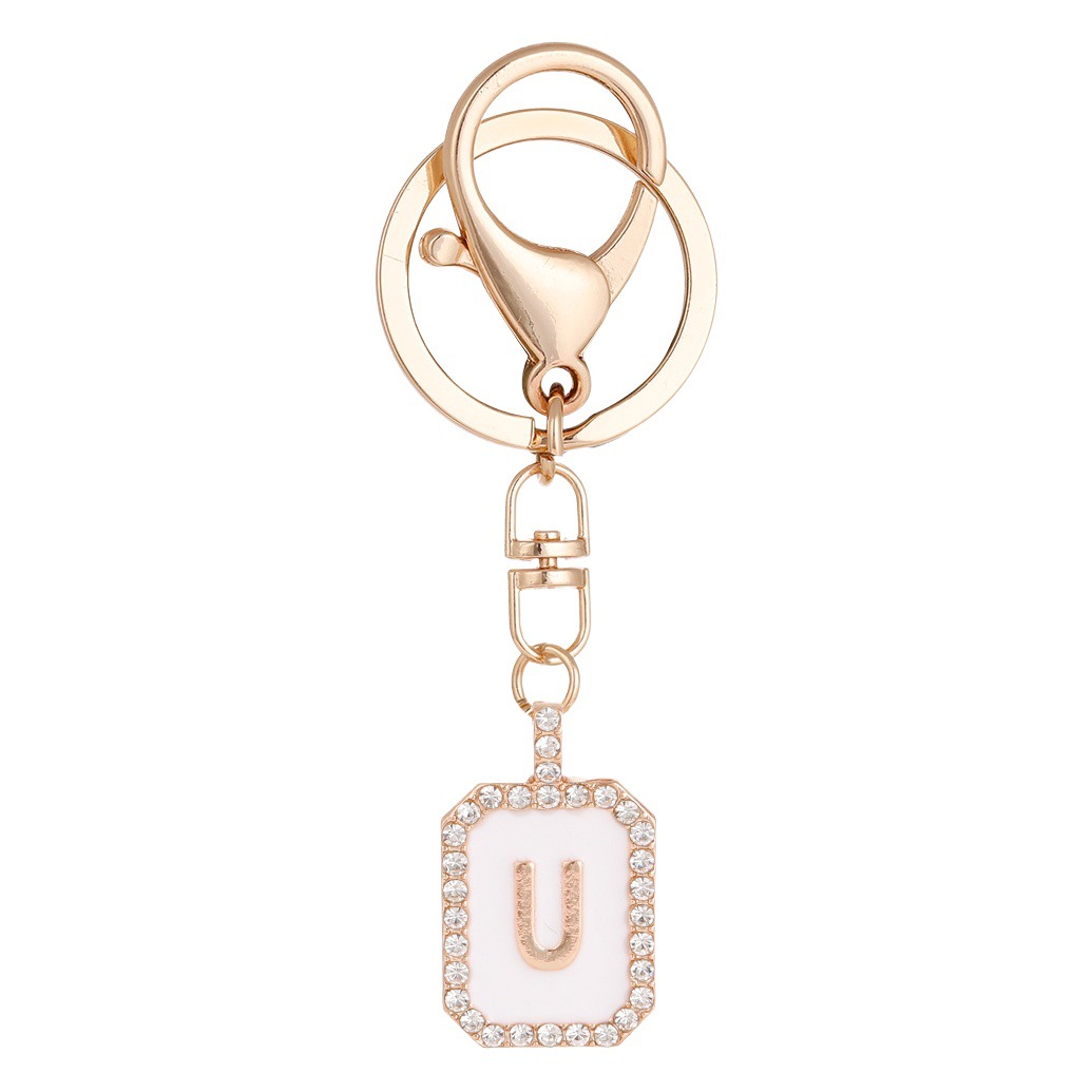 Nueva moda 26 cartas gota de diamante aceite llavero bolso del auricular pareja colgante vacaciones pequeño regalo al por mayor