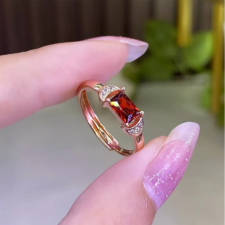 Artificial red ring with stone with zircon
