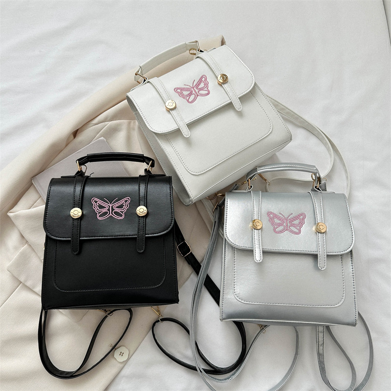 Estilo británico estilo coreano diseño de nicho ins hombro mochila bolso de las mujeres bolsa de cubo estilo universitario 2023 nueva bolsa de mensajero