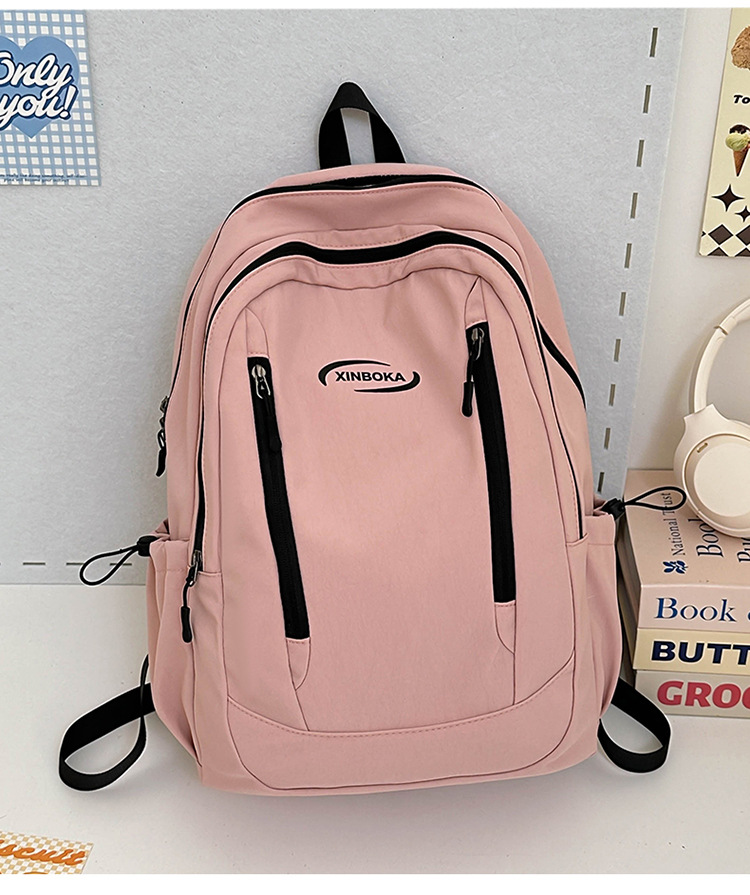 Fabricantes de mochilas escolares, estudiantes universitarias al por mayor, simples y versátiles, versión coreana de mochilas de ocio de nicho engrosadas