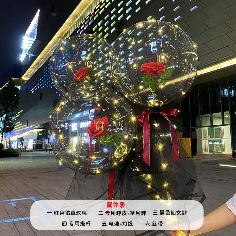 光る夜市の円形の赤い屋台のネットを並べてボールを押して会の風船のイルミネーションの明かりの告白のロマンチックな波の地帯のスーツを押します。|undefined
