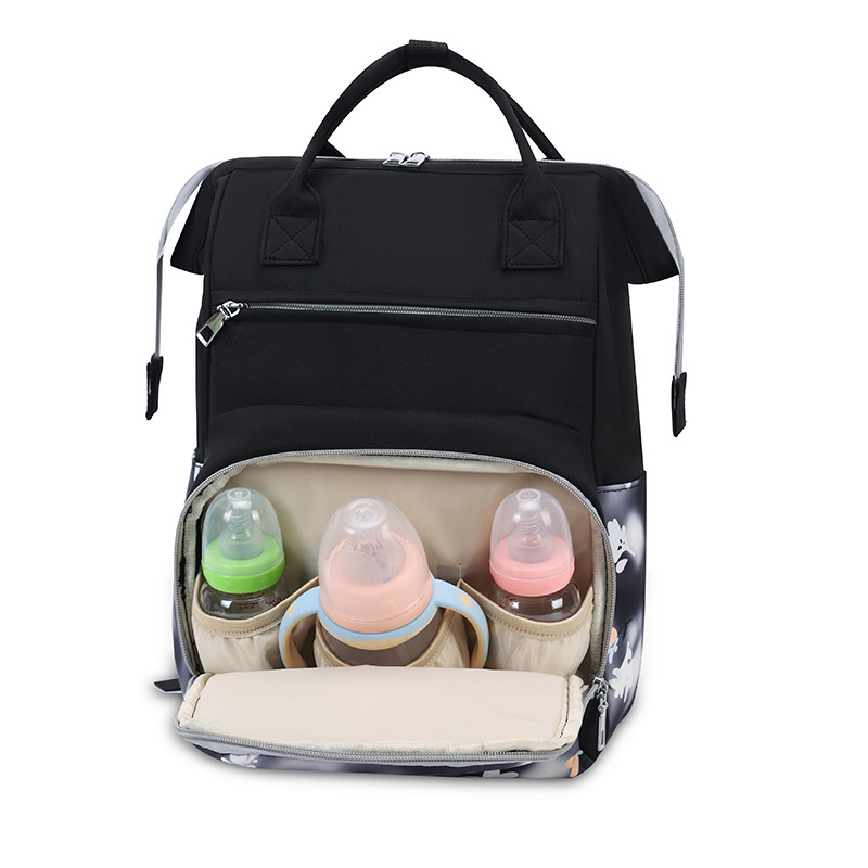 Bolsa de mamá nueva moda impresa mochila de viaje portátil mochila de mano bolsa de biberón independiente bolsa de bebé