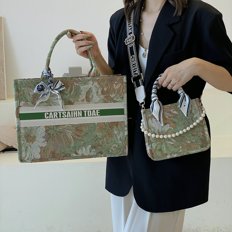 Bolso de mujer 2025, nuevo estilo transfronterizo, bolso tote con estampado de letras, con un toque de alta gama, diseño exclusivo, práctico para salidas y viajes diarios.
