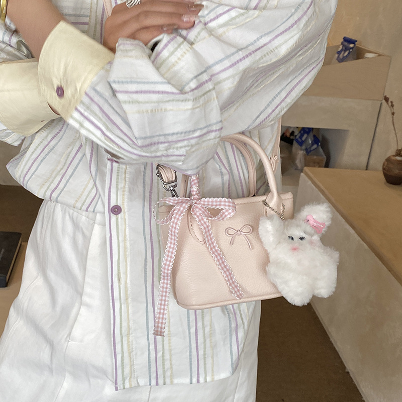 Bolsa de balde coreana para niñas estilo extranjero simple color sólido mini bebé bolsa de cesta de verduras 2026 nuevo bolso para niños