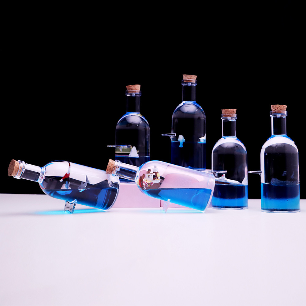 Botella a la deriva montando el viento y rompiendo las olas Botella de vela Perla Negra reloj de arena gotas de aceite Regalo de Cumpleaños descompresión decoración de escritorio al por mayor