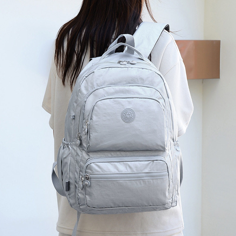 Nueva Mochila De tela impermeable pequeño mono colgante multi-compartimiento Mochila GRANDE mochila de viaje para estudiantes masculinos y femeninos