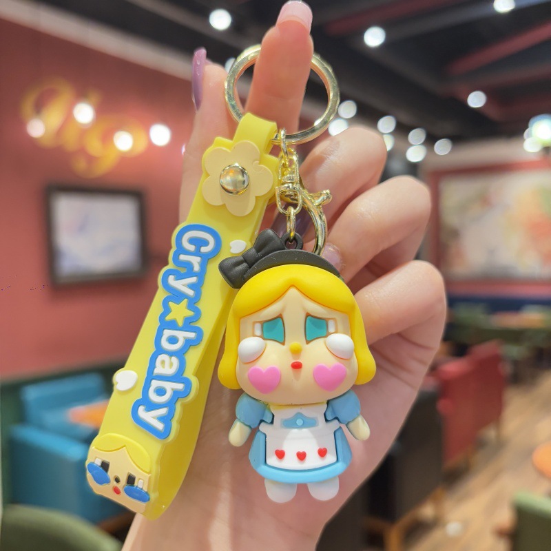 Llavero de bebé llorando de dibujos animados tridimensional linda niña mochila colgante colgante pareja llavero de coche al por mayor comercio exterior