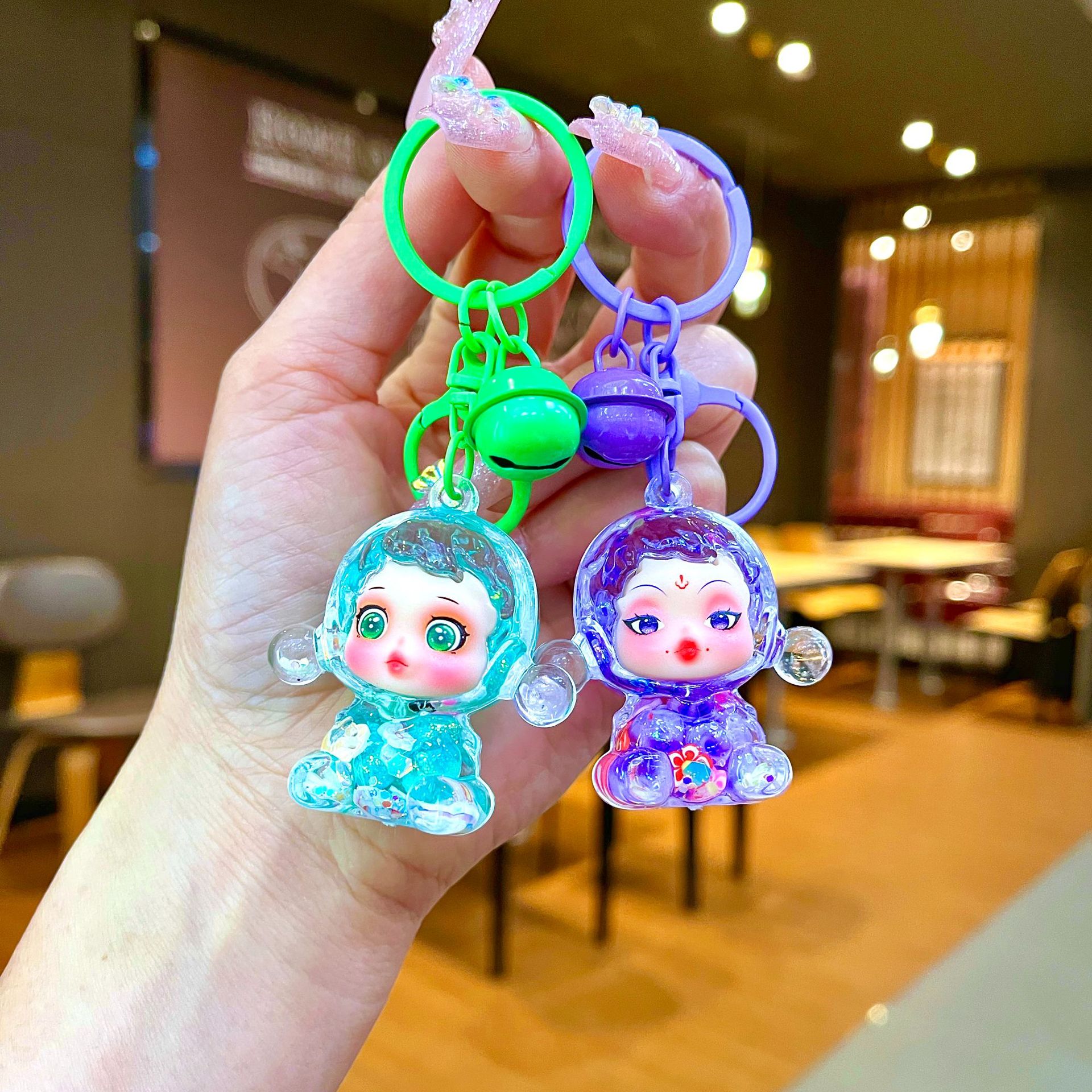 La nueva muñeca de la burbuja intermitente, llavero de arena movediza aceitosa, adornos luminosos, caja ciega de Douyin, adornos de escritorio