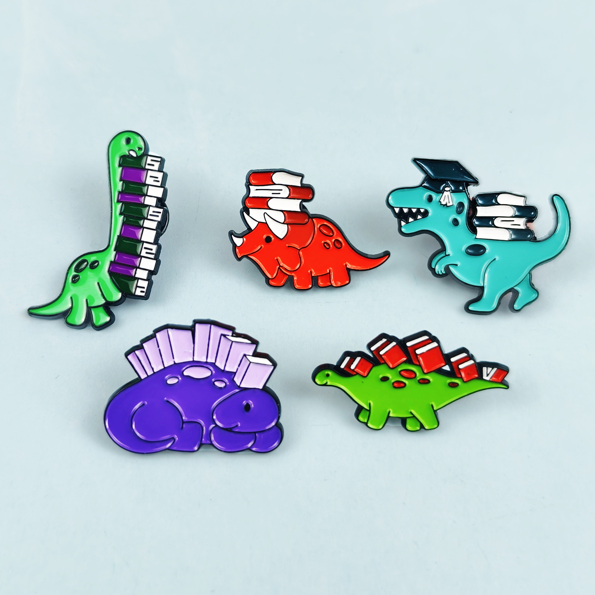 Insignia de broche de aceite de gota de aleación de dibujos animados, joyería europea y americana transfronteriza, lindo dinosaurio, aprendizaje, accesorios de libro, broche en stock