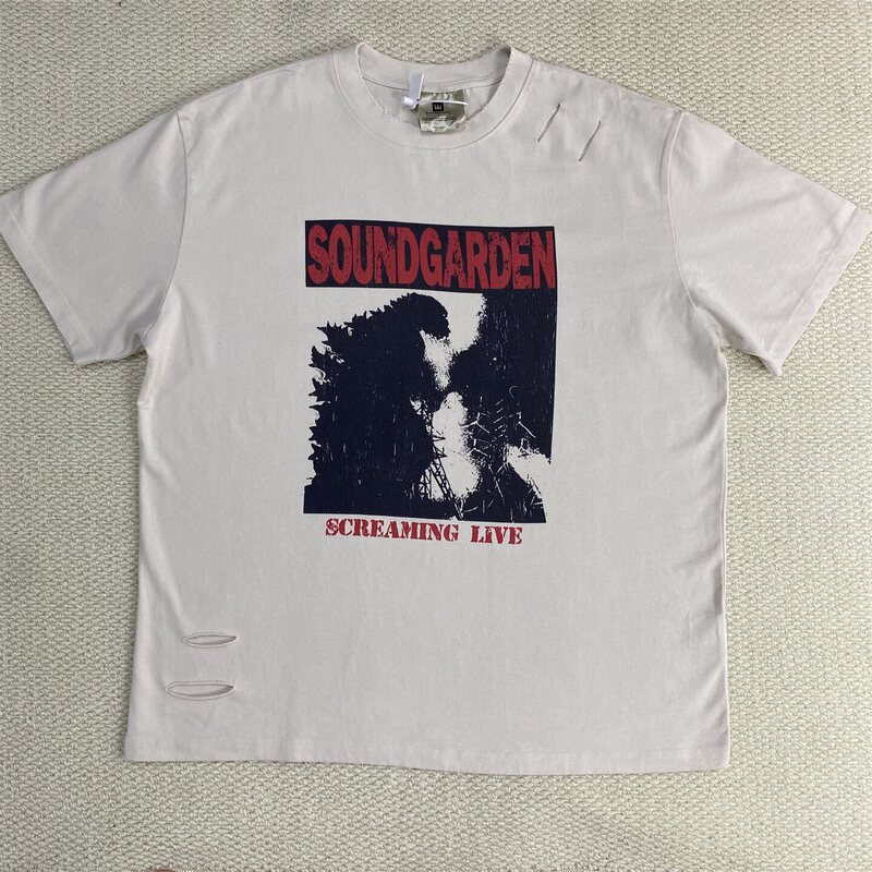 Retro rock band Godzilla graphic print short-sleeve T-shirt, unisex streetwear casual style, distressed and ripped design Retro rock band Godzilla graphic print short-sleeve T-shirt, unisex streetwear casual style, distressed and ripped design