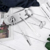 Silver set of four candle tools (with candle bells)
