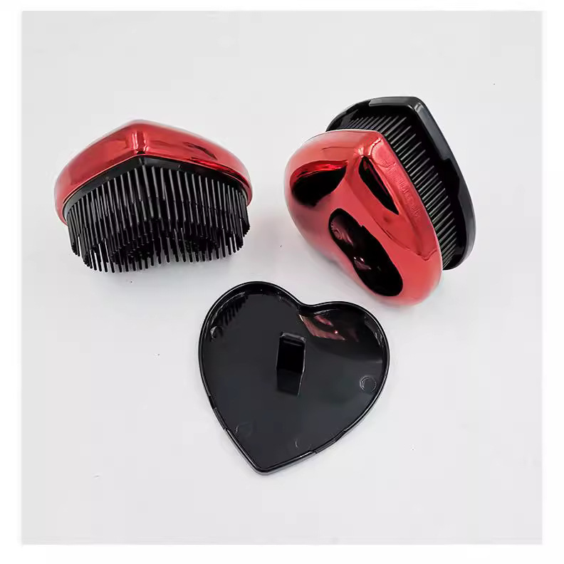 Fábrica al por mayor plástico peine Shunfa huevo peine creativo portátil cojín de aire masaje peine plástico peine en forma de corazón shunfa peine