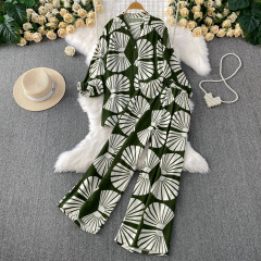 ファッションスーツの女性の夏のデザインの大衆のプリントの泡の長袖のシャツは腰が高くて痩せています。