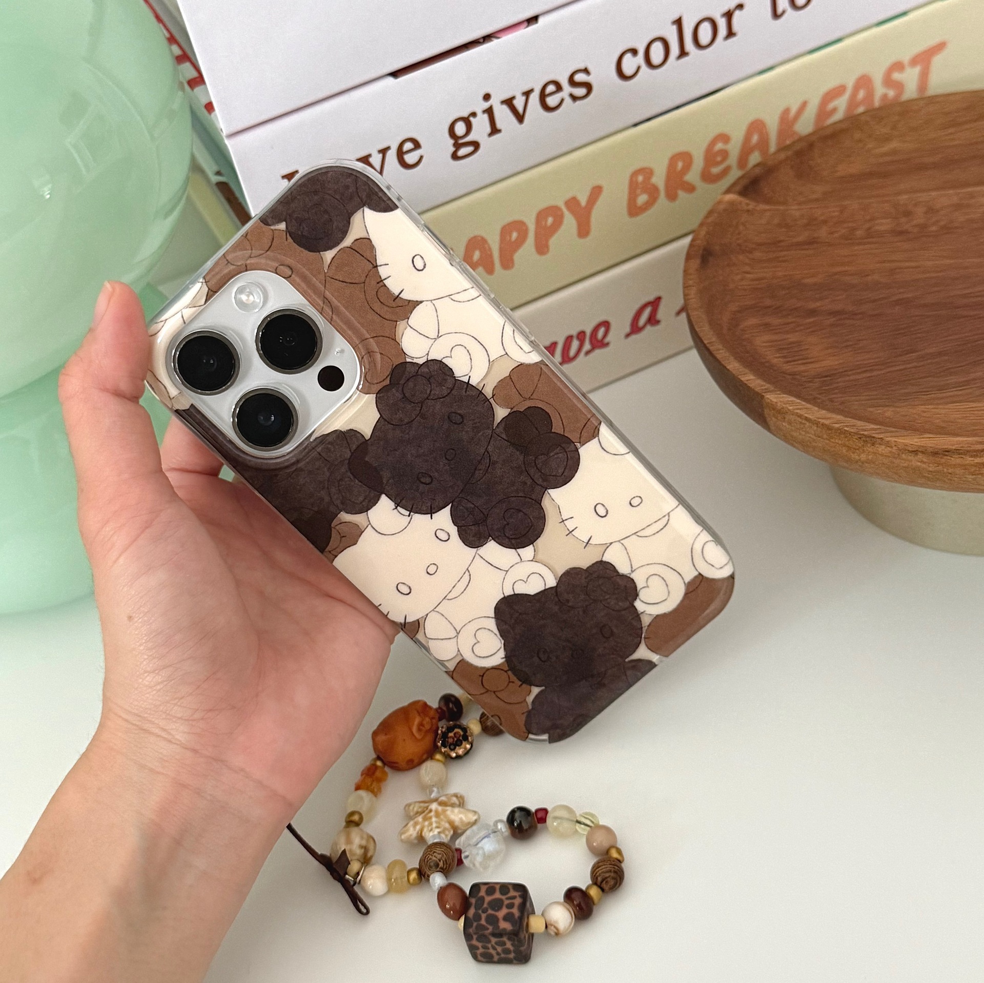 Divertida galleta de dibujos animados KT gato para Apple 16ProMax funda para teléfono móvil 15Pro nicho 14/13 cadena 15PM