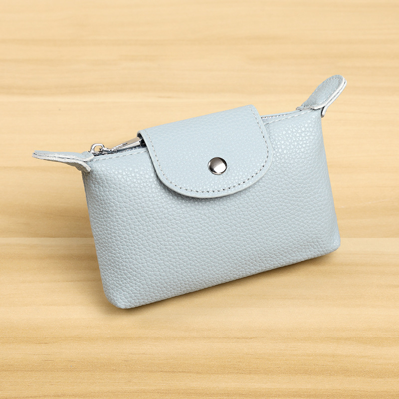 Nuevo bolso de cambio de cuero de moda para mujeres, bolso de llaves con cremallera, bolso de monedas portátil, retro y pequeño.