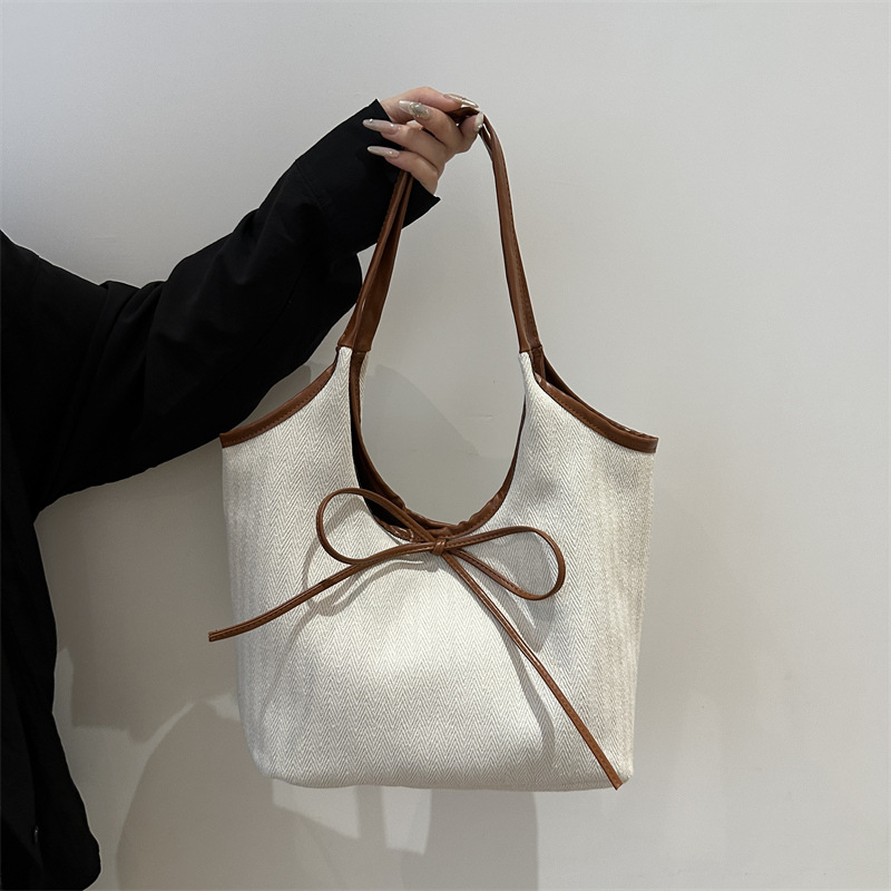 Bolsa de algodón y lino a rayas de gran capacidad para mujeres 2024 nueva bolsa de hombro universal de estilo extranjero