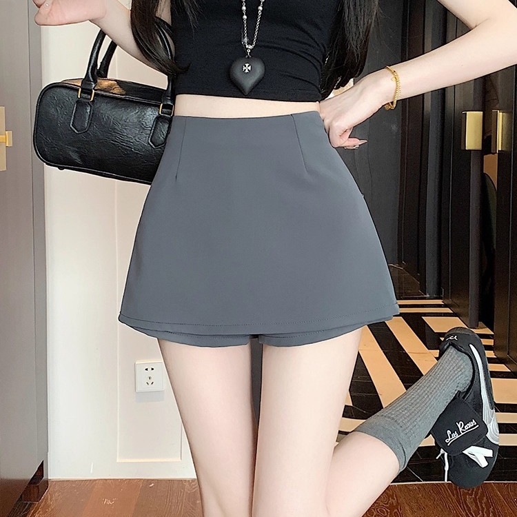 Vesta de busto negro de primavera y otoño de verano de mujeres, un diseño de pantalón con una falsa abertura de pantalón de cintura alta, una falda corta de cadera