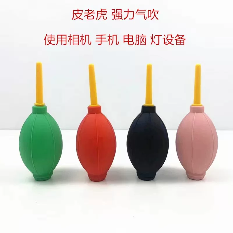 Rubber laptop, keyboard, balloon, powerful camera, lens, tiger