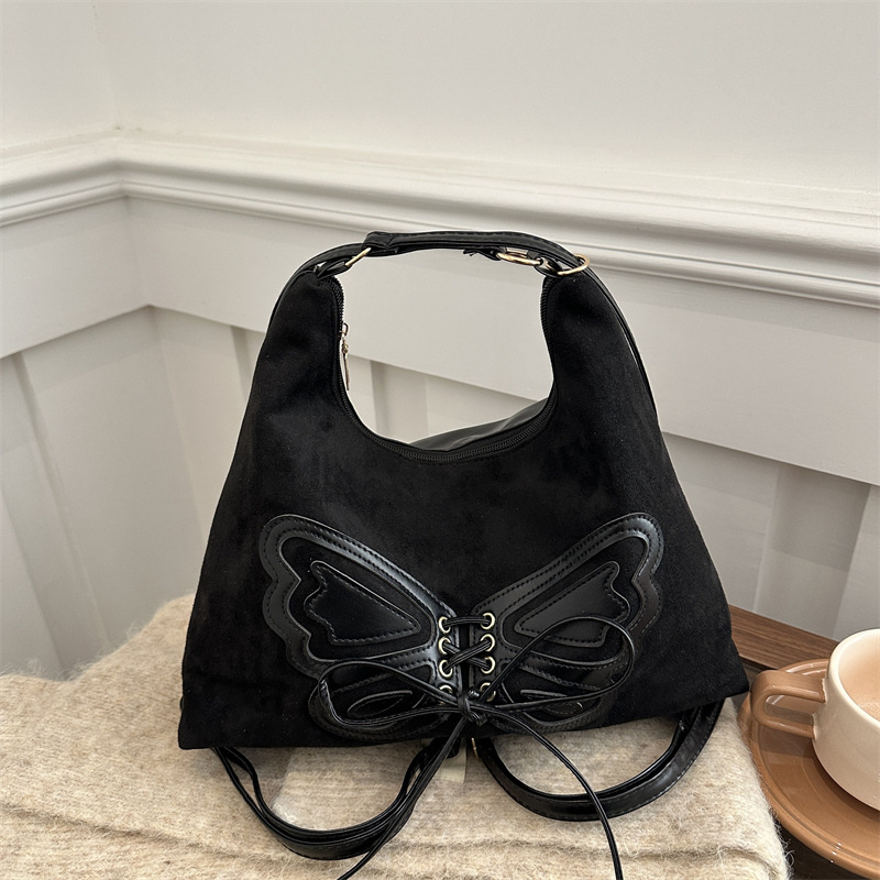 Bolsa de viaje retro ocio de otoño y invierno de 2024 nueva bolsa de hombro mariposa axillar multicapacidad de mochila