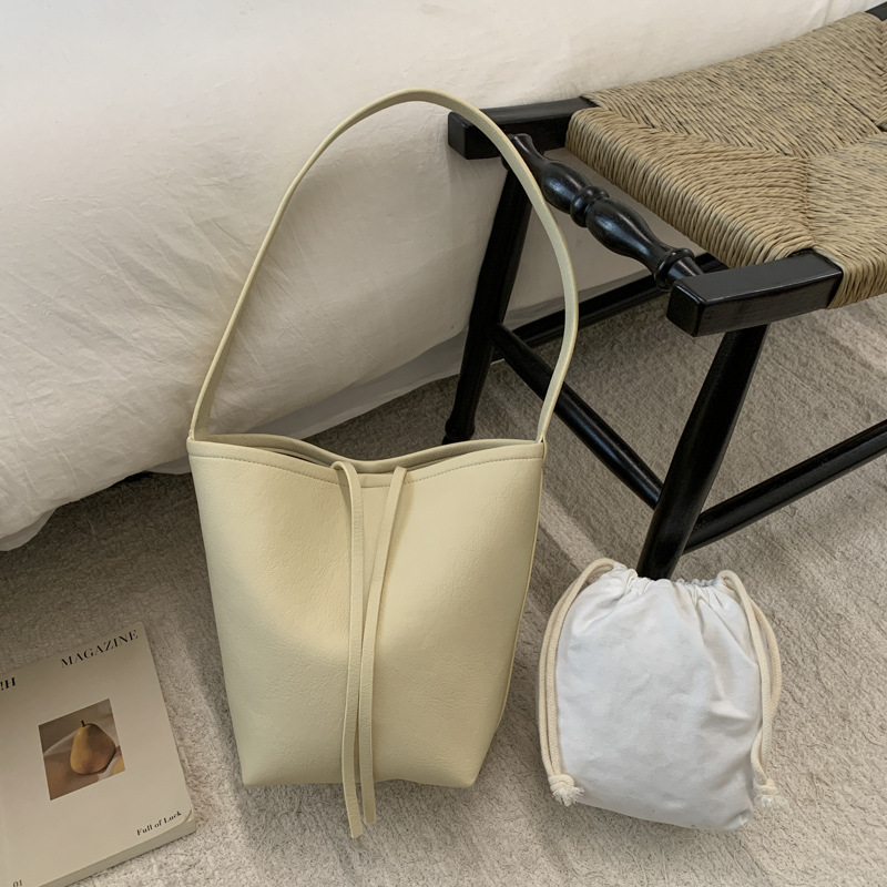 Bolsa de cubo de viaje coreano para mujeres 2025 nuevo estilo de alta calidad, bolso de hombro de cuero suave de gran capacidad, bolso de madre