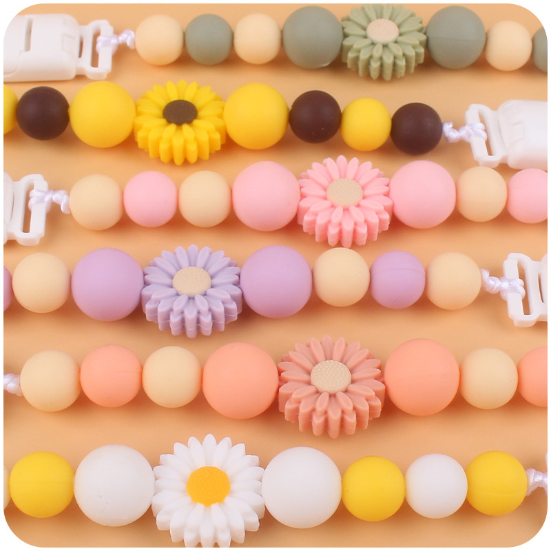 Suministros para bebés de dibujos animados flor mordedor calmante bebé de silicona mordedura pegamento molar Cadena de pezón cadena anti-caída Nuevo