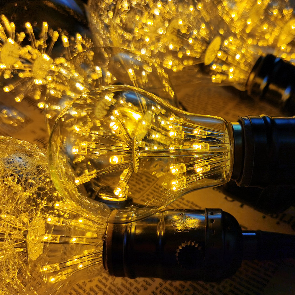 Bombilla de Edison transfronteriza estrellado luz LED E27 tornillo iluminación retro luz cálida bombilla roja neta