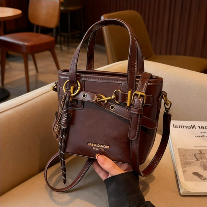 Coreano de alta calidad elegante bolso de cubo portátil para mujeres 2025 nuevo retro versátil viaje mochila de hombro