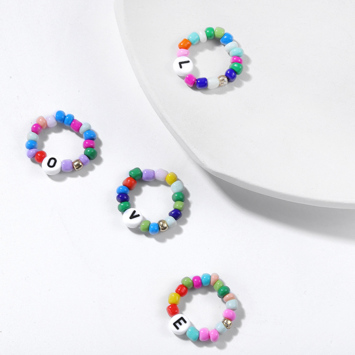 Fashion Letter Ring Elastic Beads Ring Love Ring Four-piece Wholesale display picture 4